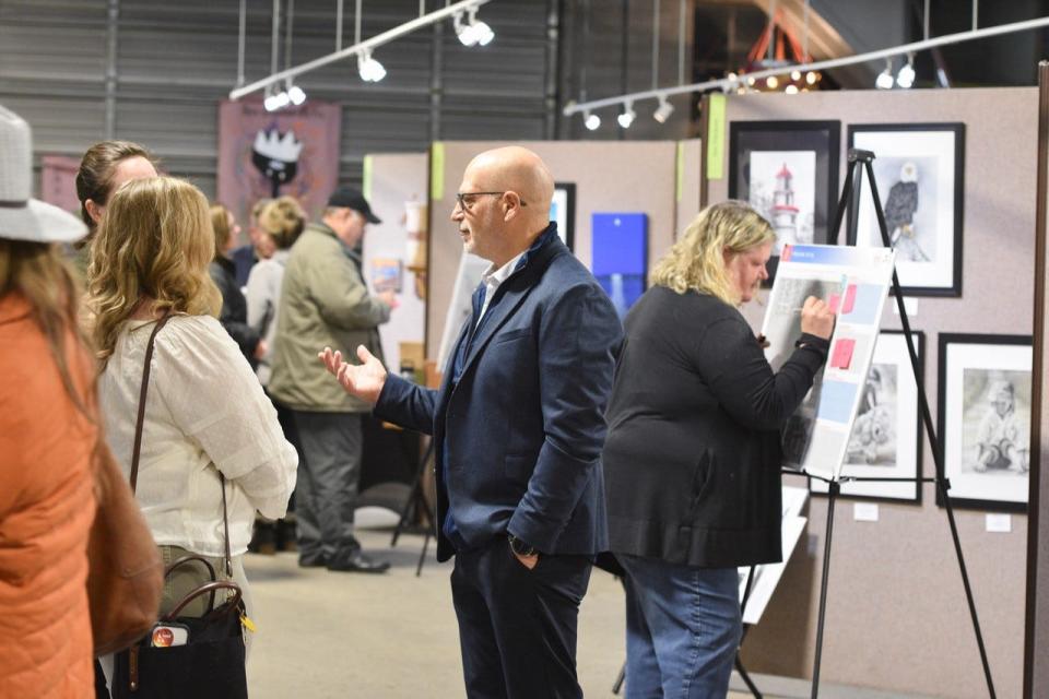 Community members discuss possibilities for park improvements during the open house at The Arts Garage on Nov. 30.