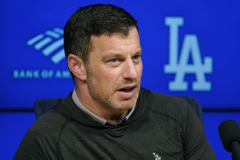 Los Angeles Dodgers President of Baseball Operations Andrew Friedman fields questions before a team workout in preparation for Game 1 of a baseball NL Division Series, Friday, Oct. 7, 2022, in Los Angeles. The Dodgers meet the winner of the wild-card series between the San Diego Padres and the New York Mets. (AP Photo/Marcio Jose Sanchez)