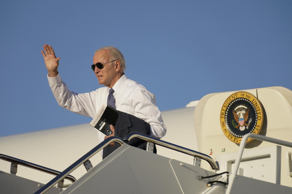 President Joe Biden waves as he boards Air Force One at Andrews Air Force Base, Md., Tuesday, Sept. 13, 2022, to travel to Wilmington, Del. (AP Photo/Andrew Harnik)