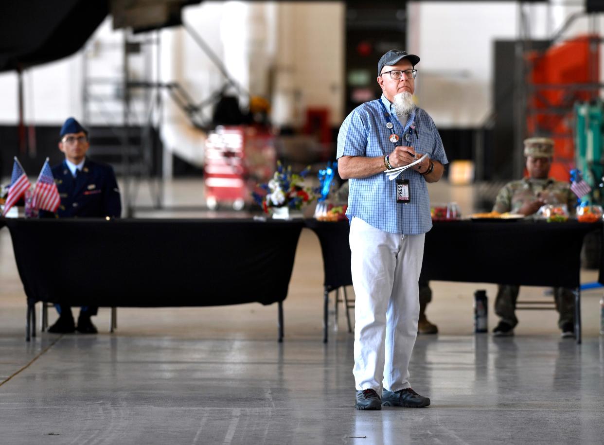 Abilene Reporter-News Editor Greg Jaklewicz takes notes at the recent 7th Bomb Wing command change ceremony that brought Col. Seth Spanier back to Dyess AFB.