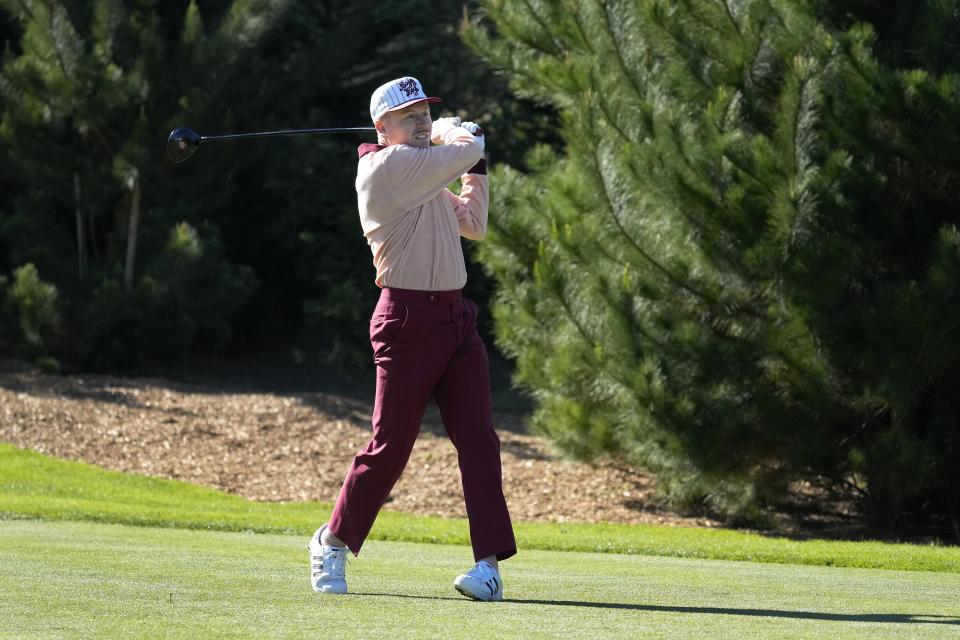 Macklemore hits from the first tee of the Spyglass Hill Golf Course during the second round of the AT&T Pebble Beach Pro-Am golf tournament in Pebble Beach, Calif., Friday, Feb. 4, 2022. (AP Photo/Tony Avelar)