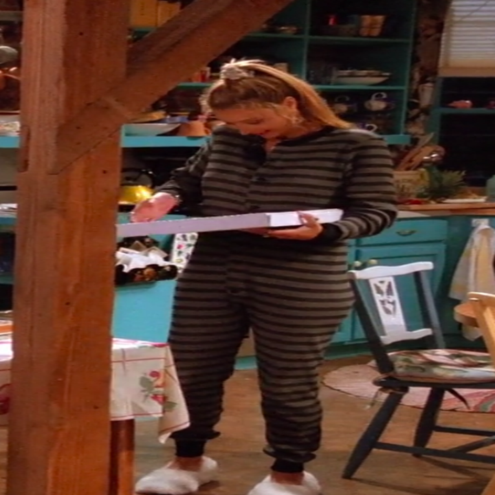 Phoebe wearing socks and onesie pajamas