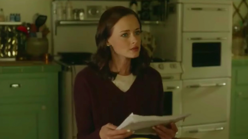 Rory Gilmore in "Gilmore Girls: A Year in the Life" holding a transcript of her book