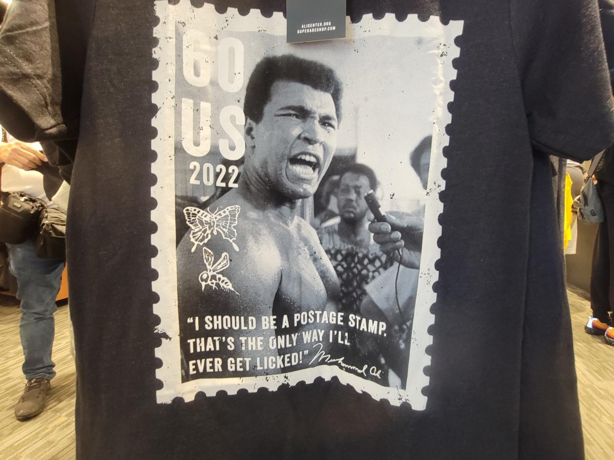 A mock stamp of Muhammad Ali is seen on a T-shirt in the Ali Center's gift shop on Friday.