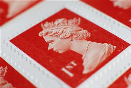 A book of first class postage stamps are seen in detail in Manchester, northern England, September 12, 2013. REUTERS/Phil Noble