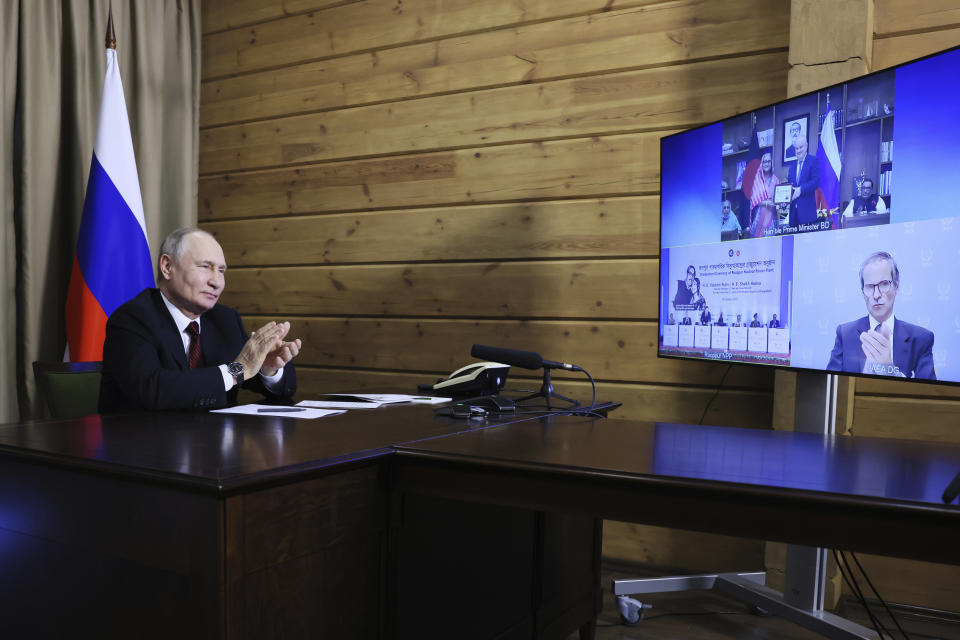 Russian President Vladimir Putin takes part in a ceremony marking the delivery of Russian nuclear fuel to the first power unit of the Rooppur NPP in Bangladesh, via videoconference call, in Sochi, Russia, Thursday, Oct. 5, 2023. Prime Minister of the People's Republic of Bangladesh Sheikh Hasina and International Atomic Energy Agency (IAEA) Director General Rafael Grossi are seen on the screen. (Mikhail Metzel, Sputnik, Kremlin Pool Photo via AP)