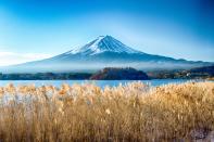 Solitary Mount Fuji is probably <a href="https://www.cntraveler.com/gallery/most-beautiful-places-in-japan?mbid=synd_yahoo_rss" rel="nofollow noopener" target="_blank" data-ylk="slk:Japan's most iconic natural wonder;elm:context_link;itc:0" class="link ">Japan's most iconic natural wonder</a>, rising 12,388 feet above villages and reflecting on lakes' surfaces. You can get views of the landmark from many places, like <a href="https://www.cntraveler.com/galleries/2014-02-25/amazing-alpine-lakes/2?mbid=synd_yahoo_rss" rel="nofollow noopener" target="_blank" data-ylk="slk:Lake Kawaguchi;elm:context_link;itc:0" class="link ">Lake Kawaguchi</a> in Fujikawaguchiko and even the <a href="https://www.cntraveler.com/hotels/japan/kamitakada/park-hyatt-tokyo?mbid=synd_yahoo_rss" rel="nofollow noopener" target="_blank" data-ylk="slk:Park Hyatt Tokyo;elm:context_link;itc:0" class="link ">Park Hyatt Tokyo</a>, but it's the views from the mountain that give you the most bragging rights. Visit from early July to mid-September (fingers crossed for 2022) to take advantage of the official climbing season, when the designated trails and paved roads are free from snow.