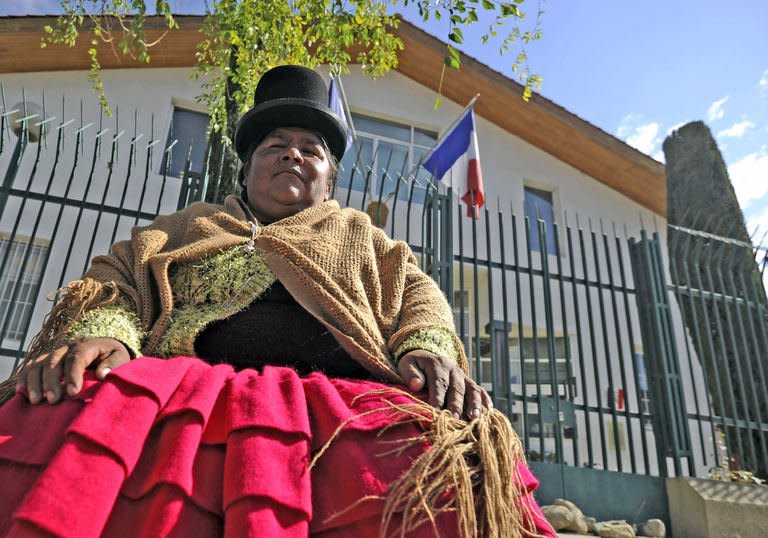 An Aymara woman sits in front of the French embassy in La Paz on June 3, 2013