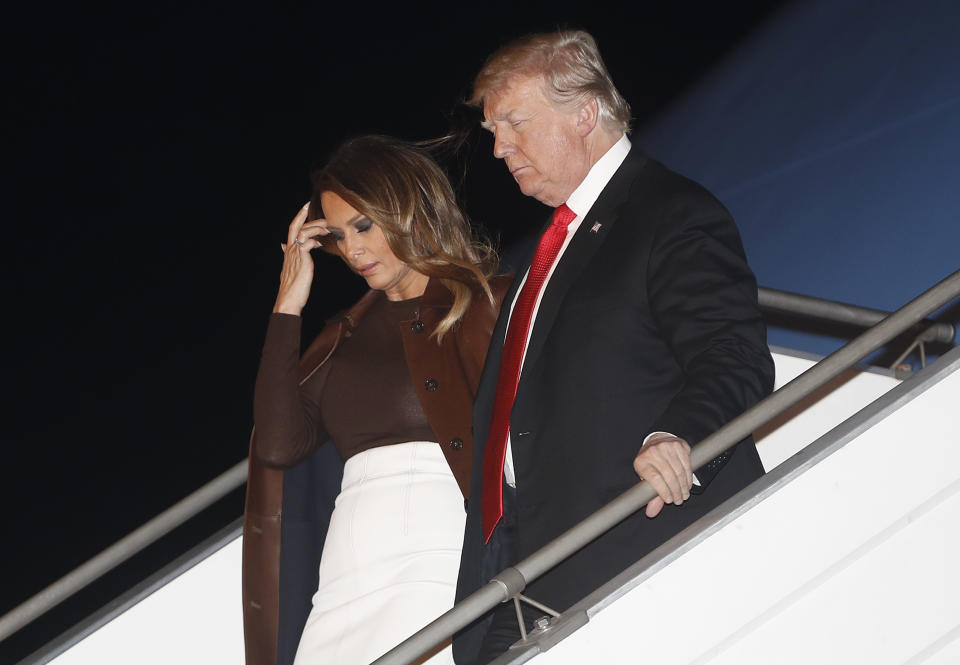 President Donald Trump and first lady Melania Trump walk from Air Force One, Thursday, Nov. 29, 2018, as they arrive at the Ministro Pistarini international airport in Buenos Aires, Argentina. Trump traveled to Argentina to attend the G20 summit. (AP Photo/Pablo Martinez Monsivais)