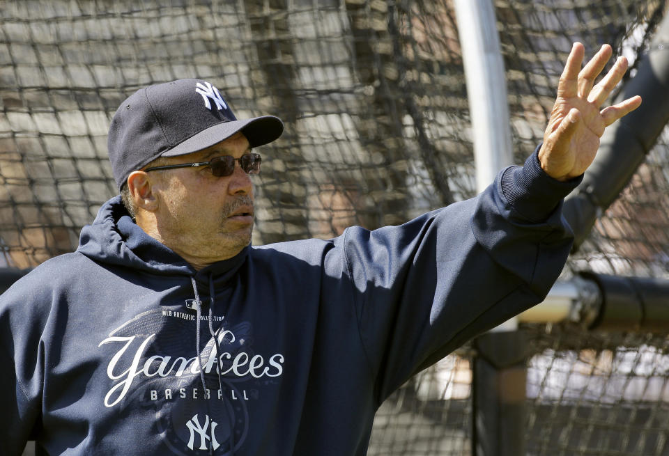 Former New York Yankees great Reggie Jackson waves to fans as he watches during practice Tuesday Feb. 24, 2009 in Tampa, Fla. (AP Photo/Chris O'Meara)