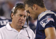 FILE - New England Patriots coach Bill Belichick, left, talks with quarterback Tom Brady during the second quarter against the Philadelphia Eagles, Saturday, Aug. 17, 2002, in Foxboro, Mass. Brady, who won a record seven Super Bowls for New England and Tampa, has announced his retirement, Wednesday, Feb. 1, 2023. (AP Photo/Michael Dwyer, File)