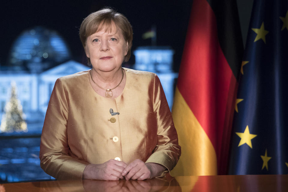 FILE - In this Dec. 30, 2020 file photo German Chancellor Angela Merkel poses for photographs after the television recording of her annual New Year's speech at the chancellery in Berlin, Germany. The coronavirus pandemic is colliding with politics as Germany embarks on its vaccination drive and one of the most unpredictable election years in its post-World War II history. (AP Photo/Markus Schreiber, File)