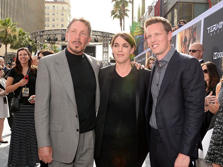 Larry, Megan, and David Ellison at a film premiere