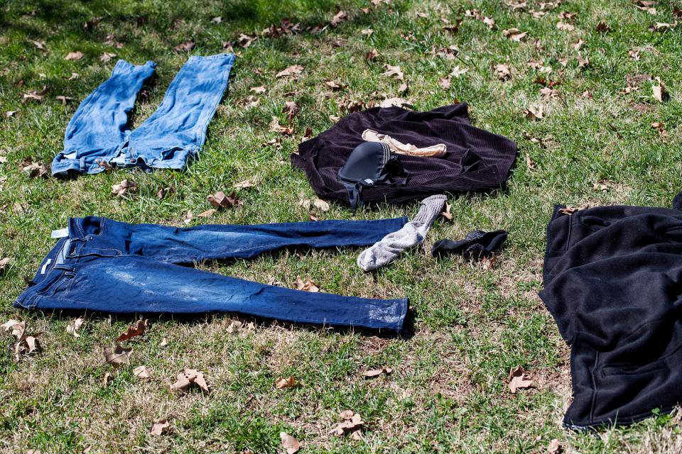 Clothes dry in the sun after a day and night of constant rain at the homeless encampment at Aston Park in Asheville March 26, 2021.