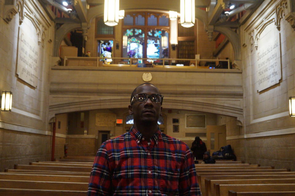 <span class="s1">Edward Chavits stands in the historical Bowery Mission Chapel in Manhattan. He completed the organization’s Gateway Program, which helps people experiencing homelessness adjust to a traditional work schedule, and is now in the Life Transformation Program, which helps people prepare to reenter the workforce. (Photo: Michael Walsh/Yahoo News)</span>