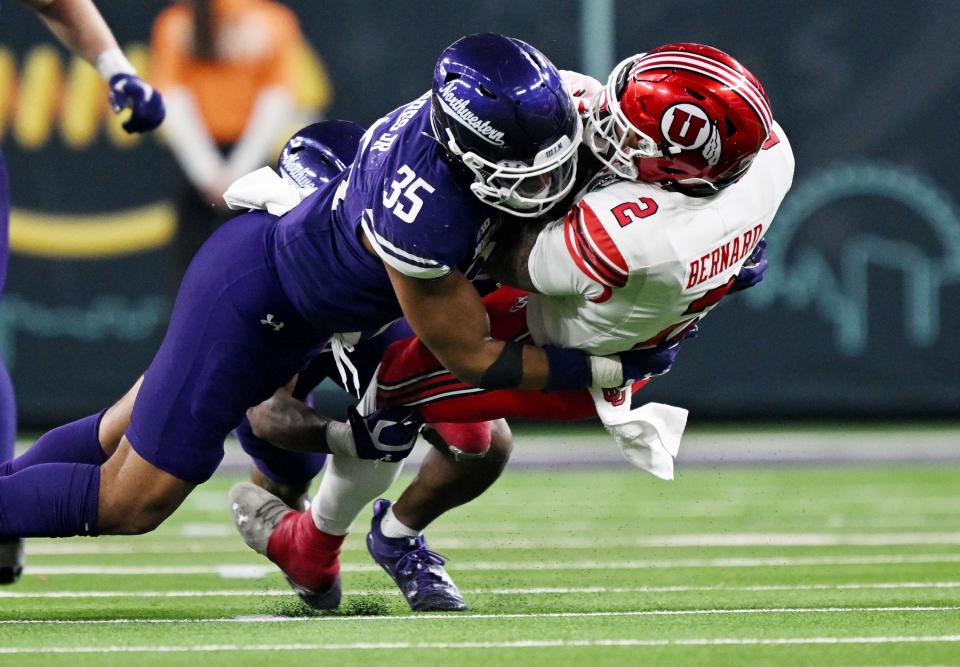 Northwestern Wildcats linebacker Kenny Soares Jr. (35) brings down Utah Utes running back Micah Bernard (2) Utah and Northwestern play in the SRS Distribution Las Vegas Bowl at Allegiant Stadium on Saturday, Dec. 23, 2023. Northwestern won 14-7. | Scott G Winterton, Deseret News