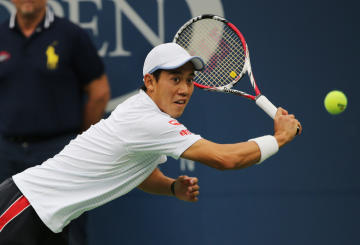 Kei Nishikori, of Japan, returns a shot against Marin Cilic, of Croatia, during the championship match of the 2014 U.S. Open tennis tournament, Monday, Sept. 8, 2014, in New York. (AP Photo/Mike Groll)