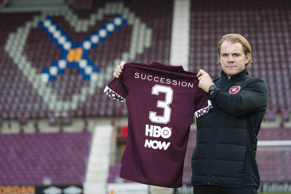 Manager Robbie Neilson unveils the Waystar Royco sponsored shirt at Tynecastle stadium