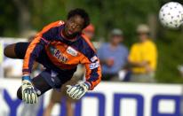 FILE - Atlanta Beat goalkeeper Briana Scurry makes a save late in the second half against the Carolina Courage, Saturday, Aug. 17, 2002, in Cary, N.C. The U.S. women's national team has not only been wildly successful on the field, the players have also been unabashedly outspoken, using their platform to advocate for equal rights for themselves and others. (AP Photo/Stan Gilliland, File)