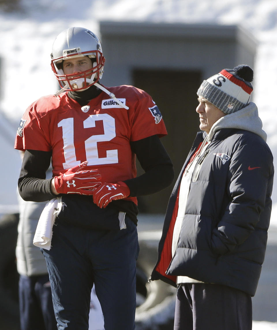 FILE - In this Jan. 18, 2018, file photo, New England Patriots quarterback Tom Brady, left, stands with head coach Bill Belichick during an NFL football practice, in Foxborough, Mass. Many of the faces change every year in Miami, Buffalo, New York _ and even in Foxborough _ but Bill Belichick and Tom Brady are constants in the division. (AP Photo/Steven Senne, File)