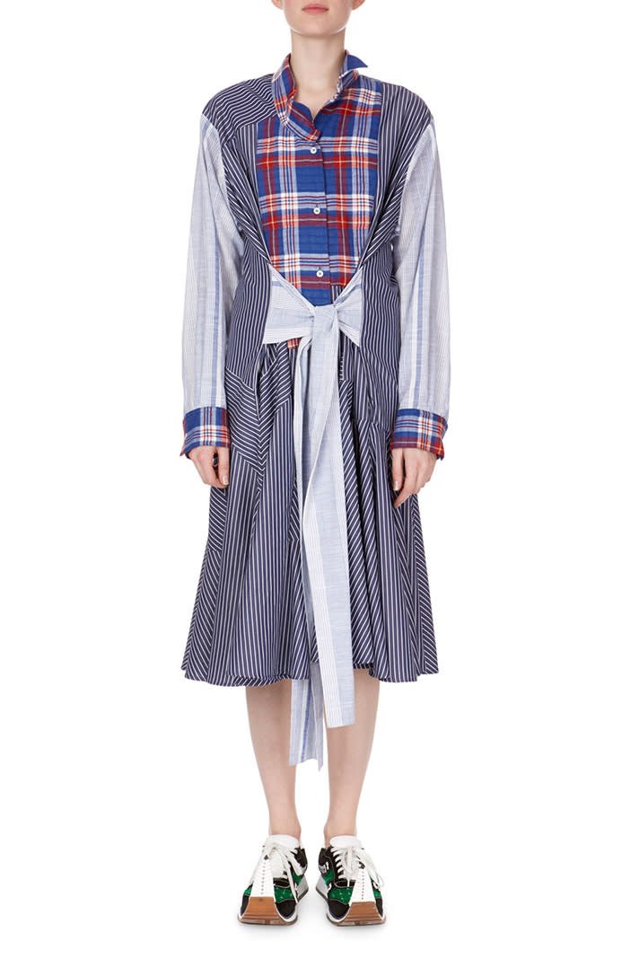 Plaids and pinstripes don't have to clash. <em>Loewe long-sleeve combo shirtdress, $1,490 at <a href="https://www.bergdorfgoodman.com/Loewe-Long-Sleeve-Tie-Waist-Check-Stripe-Combo-Shirtdress/prod137370081/p.prod" rel="nofollow noopener" target="_blank" data-ylk="slk:Bergdorf Goodman;elm:context_link;itc:0;sec:content-canvas" class="link ">Bergdorf Goodman</a></em>