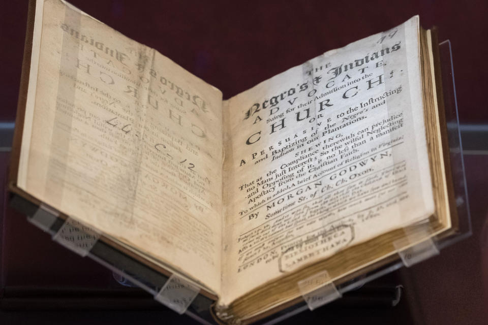 A book written in 1680 by Anglican clergyman Morgan Godwyn, who argued endorsing the slave trade amounted to making a deal with the Devil, is displayed at the exhibition in the Lambeth Palace Library, in London, Tuesday, Jan. 31, 2023. A letter written by an enslaved person in Virginia 300 years ago seeking freedom is part of a new exhibition exploring the Church of England's historic links to slavery. It's part of efforts by the Anglican church to reckon with its historic complicity in slavery. (AP Photo/Kin Cheung)