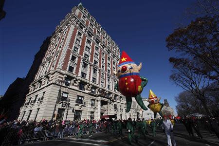 A Santa's Elf balloon floats down Central Park West during the 87th Macy's Thanksgiving Day Parade in New York November 28, 2013. REUTERS/Gary Hershorn