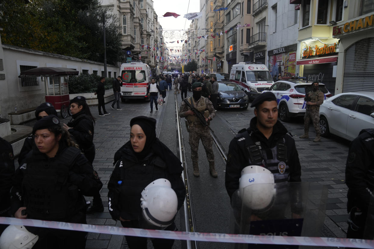 Security and ambulances at the scene after an explosion on Istanbul's popular pedestrian Istiklal Avenue, Sunday, Nov. 13, 2022. Istanbul Gov. Ali Yerlikaya tweeted that the explosion occurred at about 4:20 p.m. (1320 GMT) and that there were deaths and injuries, but he did not say how many. The cause of the explosion was not clear. (AP Photo/Francisco Seco)