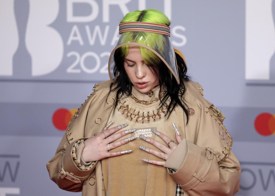 Billie Eilish poses for photographers upon arrival at Brit Awards 2020 in London, Tuesday, Feb. 18, 2020.(Photo by Vianney Le Caer/Invision/AP)
