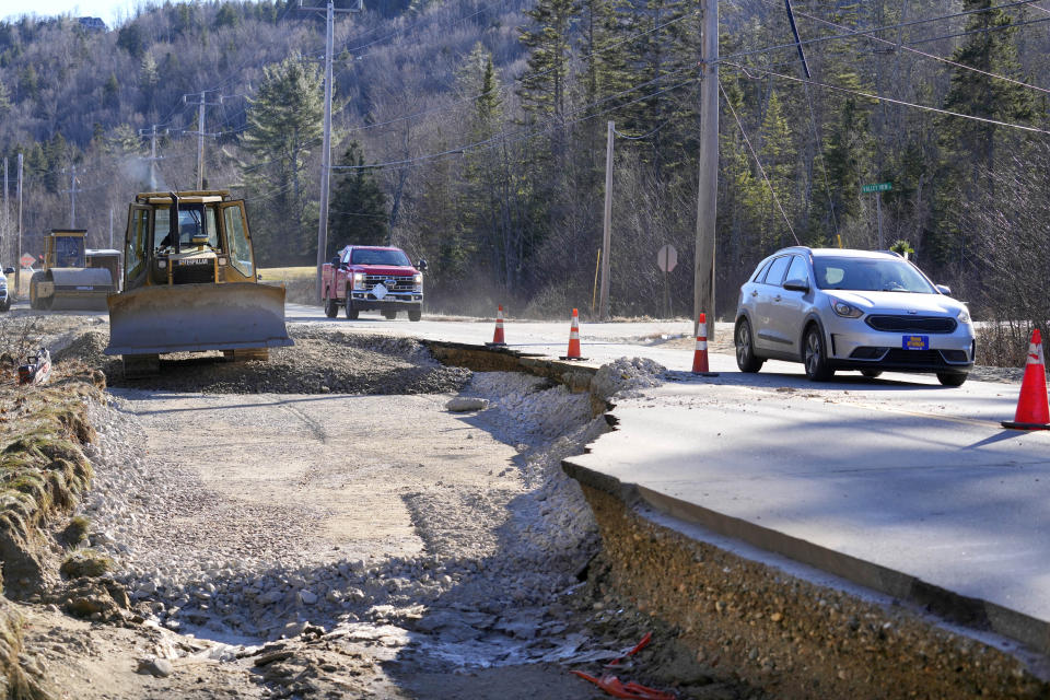 A road to Sunday River ski resort is rebuilt following this week's disastrous rainstorm, Thursday, Dec. 21, 2023, in Newry, Maine. The New England ski industry is working to recover before the Christmas vacation season. (AP Photo/Robert F. Bukaty)