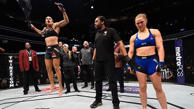 Nunes jumps for joy as Rousey contemplates her future. Pic: Getty