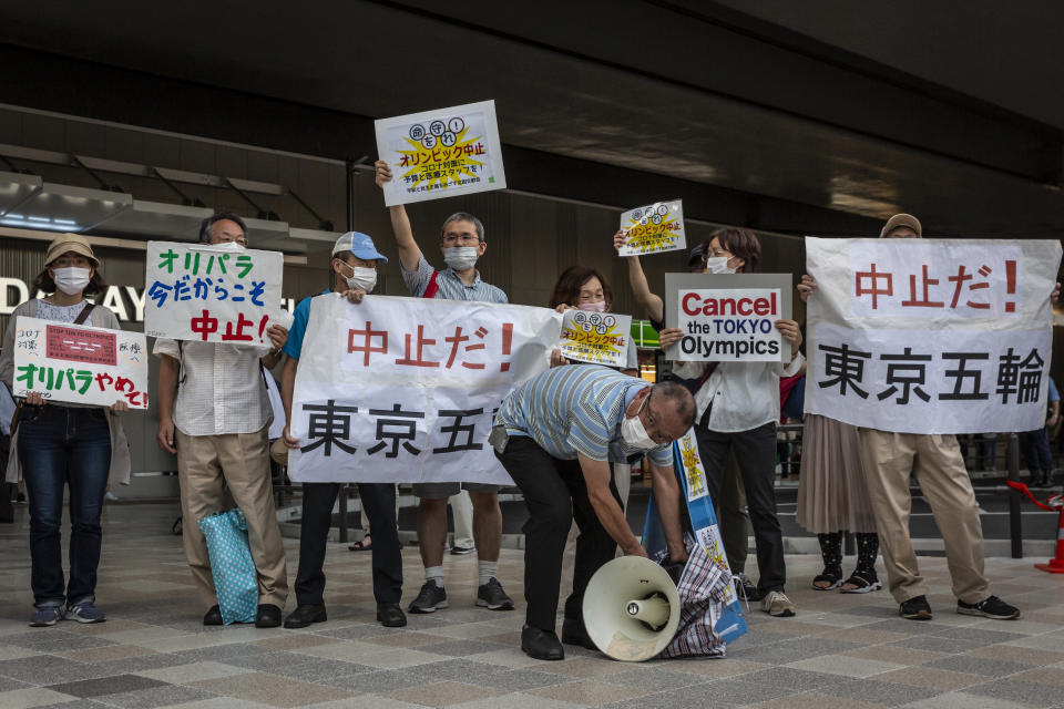 TOKYO, JAPAN - JULY 23: Anti-Olympics protesters demonstrate against the Tokyo Olympics on July 23, 2021 in Tokyo, Japan. Protesters gathered to demonstrate against the Olympic Games amid concern over the safety of holding the event during the global coronavirus pandemic as well as the cost incurred. (Photo by Yuichi Yamazaki/Getty Images)