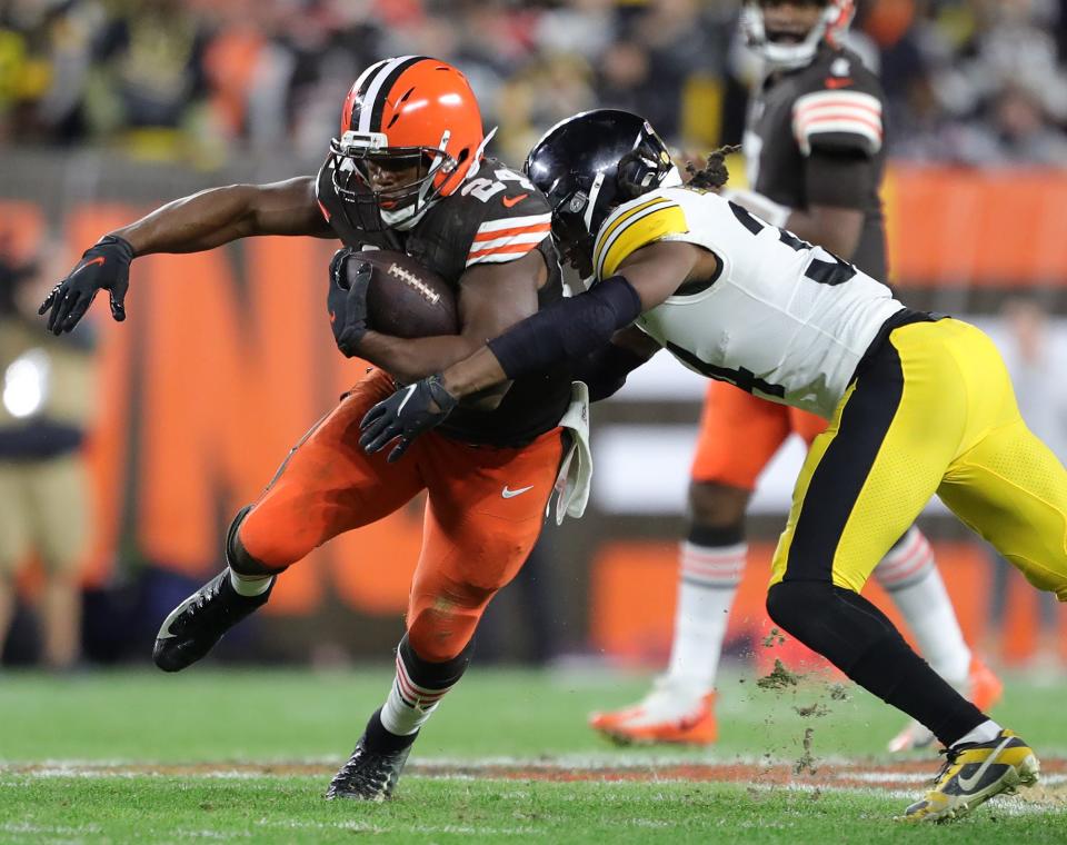 Browns running back Nick Chubb runs past Steelers safety Terrell Edmunds during the second half Thursday, Sept. 22, 2022, in Cleveland.