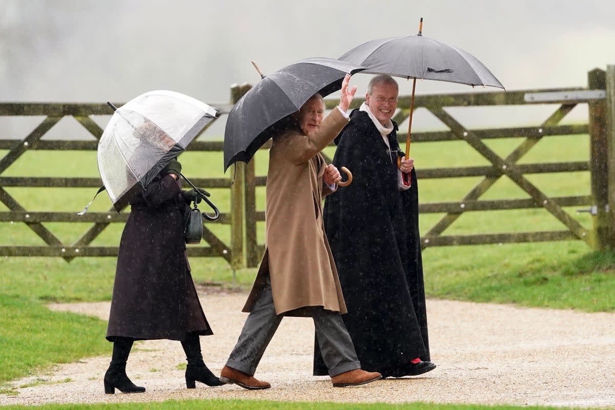 The King is flanked by Queen Camilla (PA)