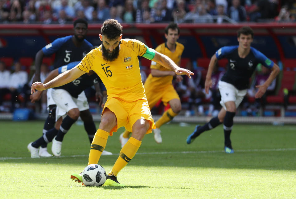 <p>Cool as you like, Australia’s Mile Jedinak slots home his penalty after a French handball </p>