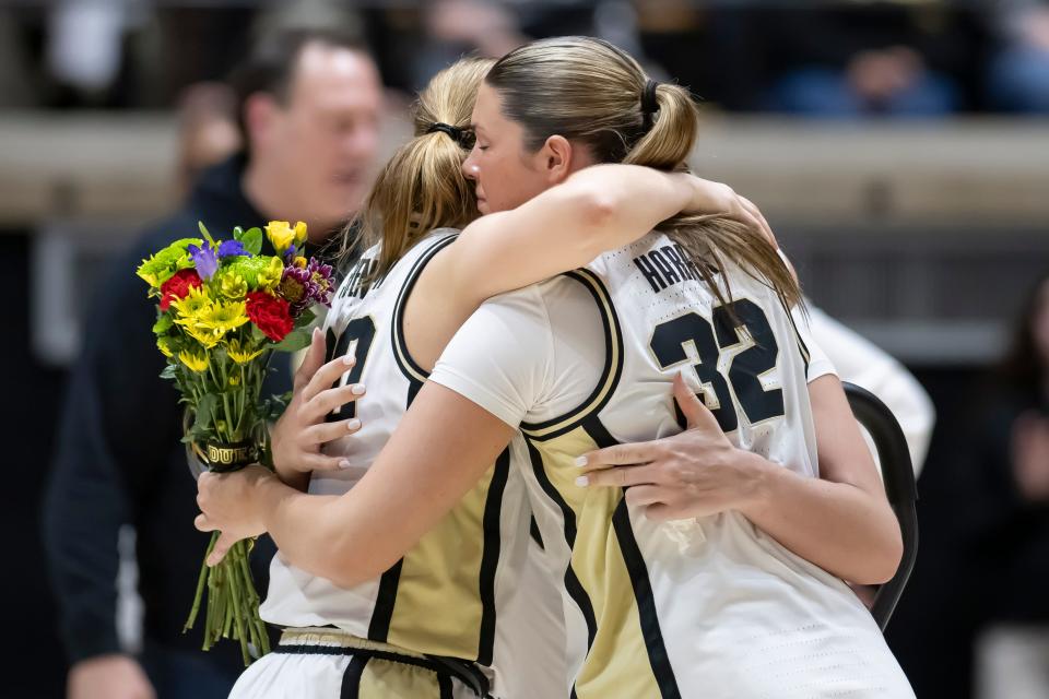 Purdue Boilermakers forward Mary Ashley Stevenson (20) and Purdue Boilermakers forward Alaina Harper (32) hug Purdue Boilermakers forward Caitlyn Harper (34) after the NCAA women’s basketball game against the Penn State Nittany Lions, Wednesday Feb. 28, 2024, at Mackey Arena in West Lafayette, Ind. Penn State won 93-88.