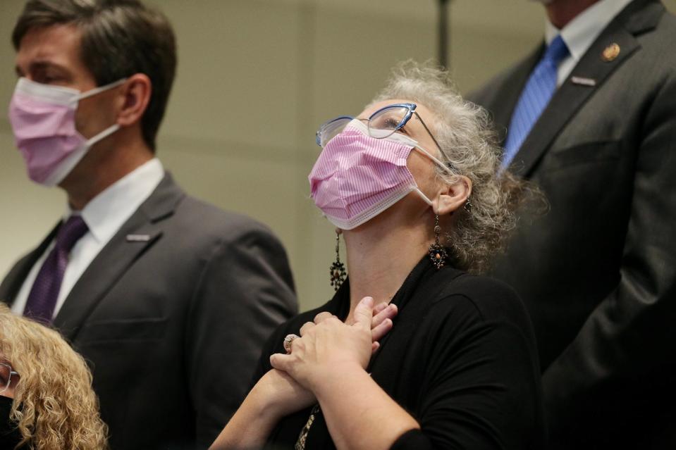 Tulsa City Council Member Crista Patrick reacts as she listens to Tulsa Mayor G.T. Bynum speak on June 2, 2022, in Tulsa, Okla. The press conference outlined the timeline of events of a mass shooting that killed multiple people at Saint Francis Hospital on June 1.