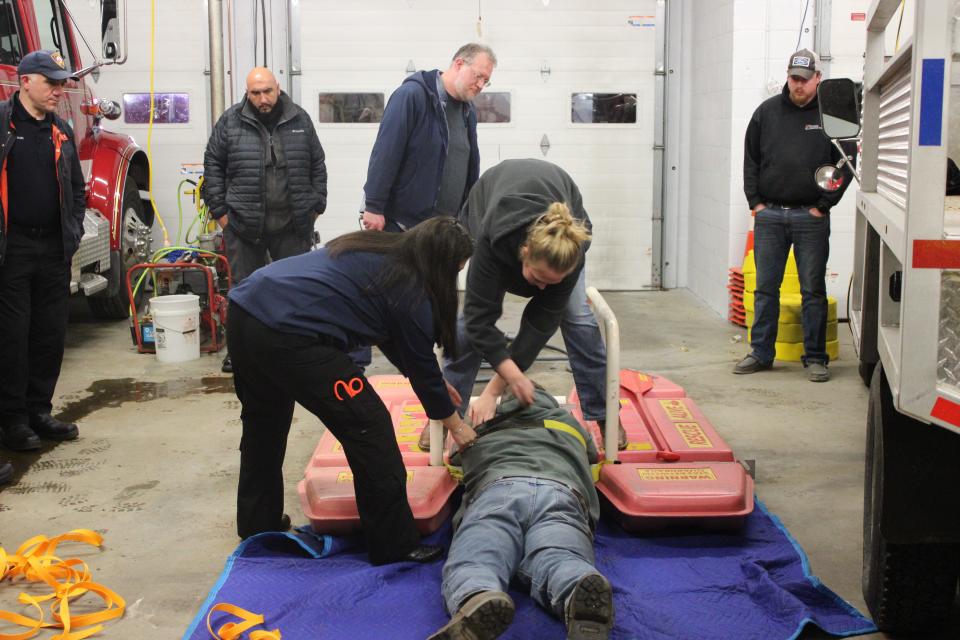 Hannah Baxter shows how to perform an ice rescue at a training meeting at Petersham Fire Department. Baxter, a volunteer firefighter, is a senior at Quabbin and stars on the basketball team.