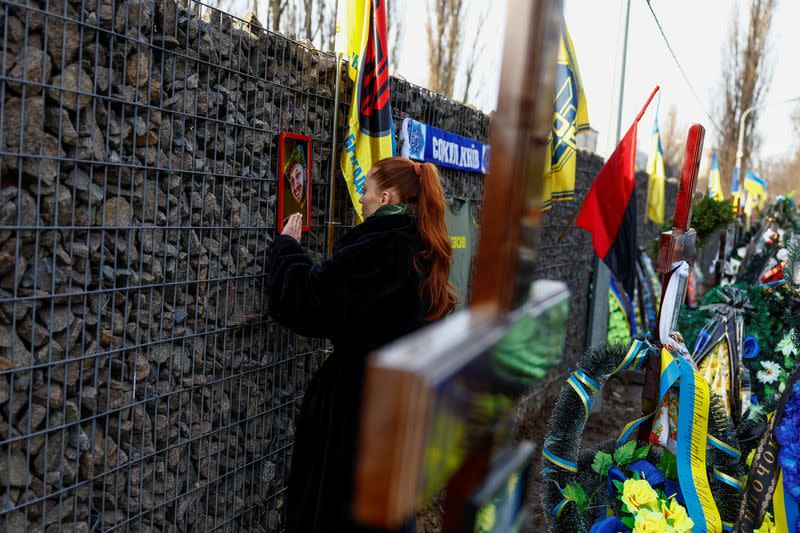 FILE PHOTO: Ukrainian actor Birzul visits grave af her younger brother Krotov in Kyiv