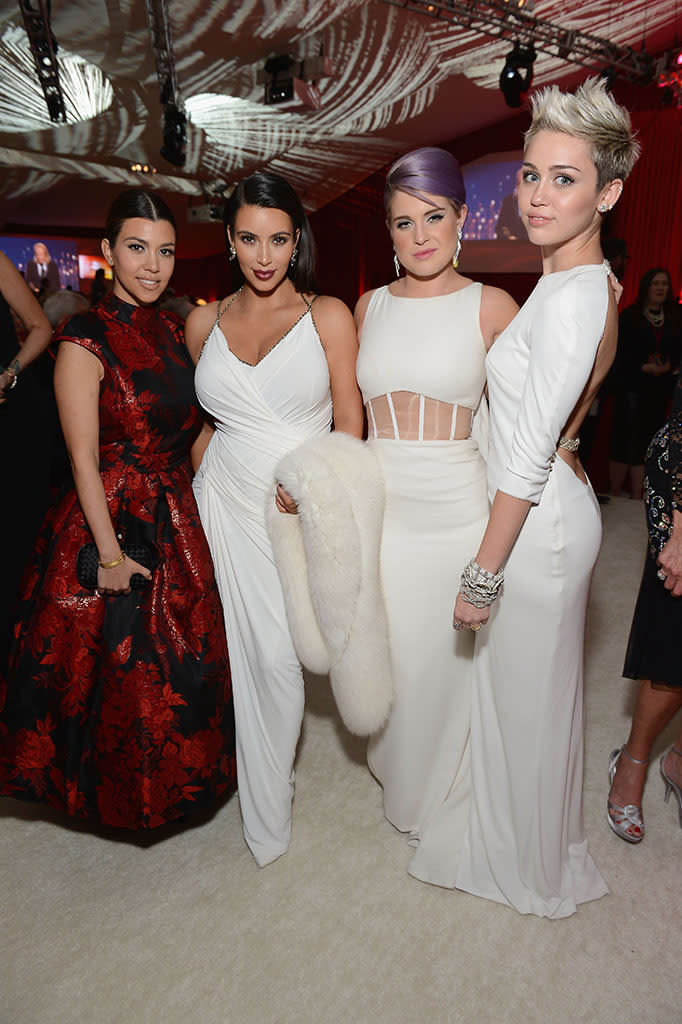 Kourtney Kardashian, Kim Kardashian, Kelly Osbourne and Miley Cyrus attend the 21st Annual Elton John AIDS Foundation Academy Awards Viewing Party at Pacific Design Center on February 24, 2013 in West Hollywood, California.