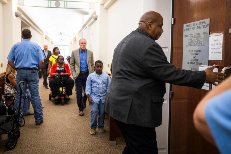 Atatiana Jefferson’s family comes into the courtroom for a recusal hearing on Judge David Hagerman’s status in the Aaron Dean case Thursday, June 23, 2022, in Fort Worth.