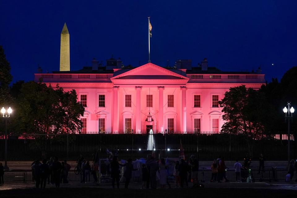 Pink lights illuminate the White House in recognition of Breast Cancer Awareness month