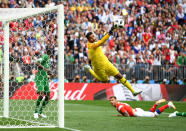 <p>Abdullah Almuaiouf of Saudi Arabia makes a save from a Fedor Smolov effort in the first half. (PA) </p>
