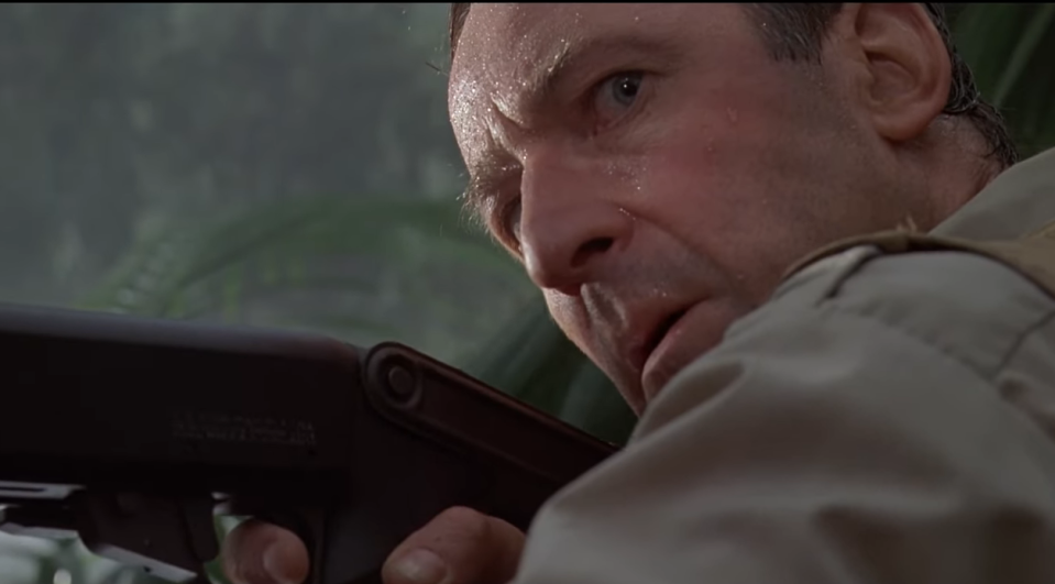 Muldoon holding a rifle in Jurassic Park