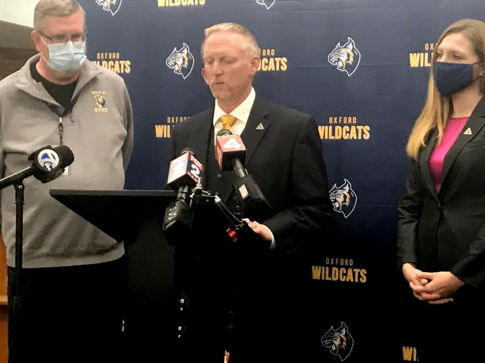 Superintendent Tim Throne, center, is flanked by other school officials during a press conference on December 14, 2021.