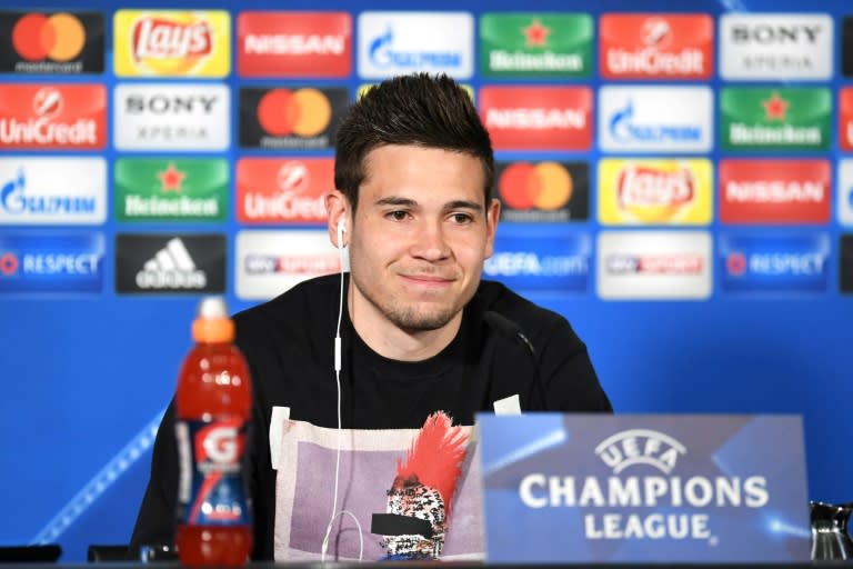 Dortmund's Portuguese defender Raphael Guerreiro answers questions during a press conference in Dortmund, on April 10, 2017