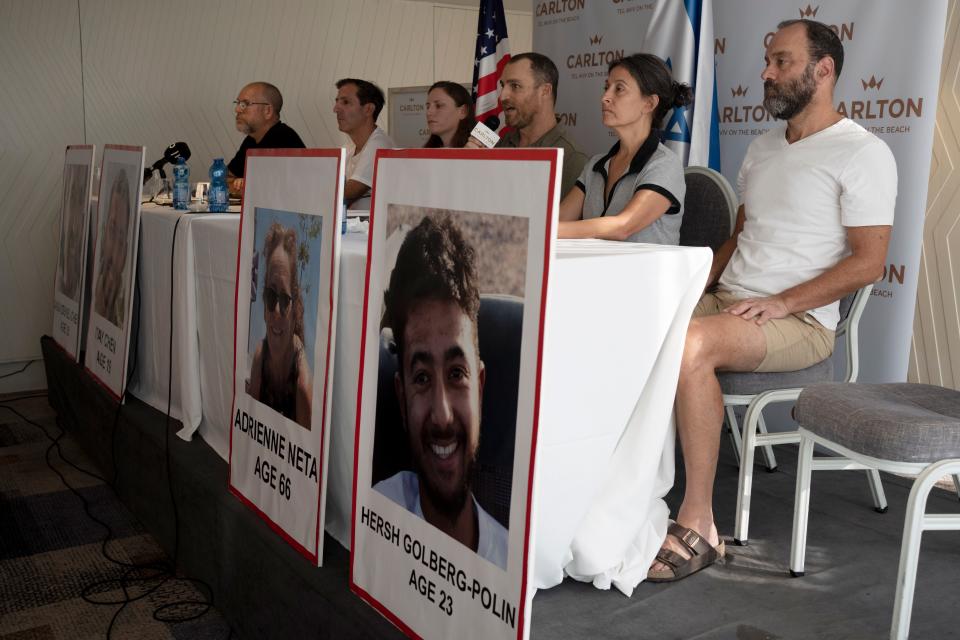 Relatives of U.S. citizens that are missing since Saturday's surprise attack by Hamas militants near the Gaza border, in Tel Aviv, Israel attend a news conference on Tuesday, Oct. 10, 2023 in Tel Aviv, Israel. Seated from left: Jonathan Dekel-Chen, father of Sagui Dekel-Chen (35) from Nahal Oz; Ruby Chen, father of Itay Chen, 19, a soldier in the armored corps; Ayala Neta, daughter, and Nahal Neta, son of Adrienne Neta, 66, a nurse living in Kibbitz Be'eri; Rachel Goldberg, mother of Hersh Goldberg-Polin, 23, who was attending the music festival, and Jonathan Polin, Hersh's father. (AP Photo/Maya Alleruzzo) ORG XMIT: XMA102