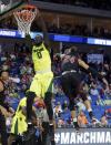 <p>Baylor forward Jo Lual-Acuil Jr. (0) of Australia dunks the ball in front of New Mexico State guard Matt Taylor (24) during a first-round game in the men’s NCAA college basketball tournament in Tulsa, Okla., Friday March 17, 2017. (AP Photo/Tony Gutierrez) </p>