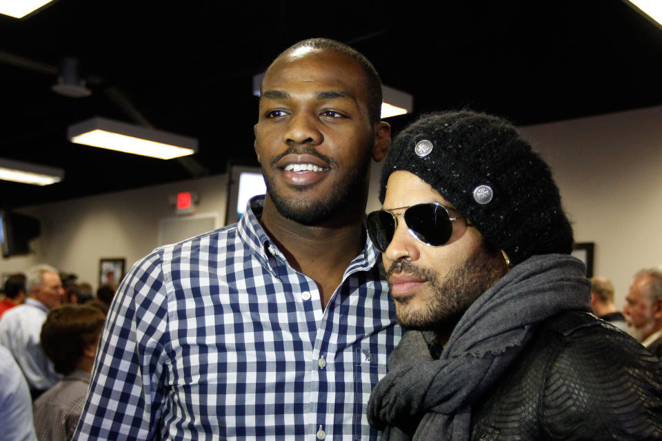 DAYTONA BEACH, FL - FEBRUARY 26: UFC fighter Jon Jones poses with musician Lenny Kravitz during the driver's meeting prior to the start of the NASCAR Sprint Cup Series Daytona 500 at Daytona International Speedway on February 26, 2012 in Daytona Beach, Florida. (Photo by Chris Graythen/Getty Images)