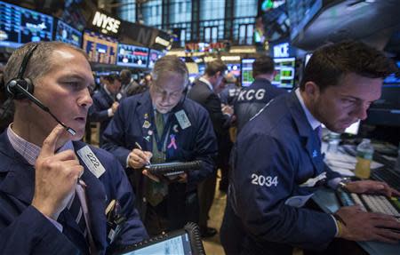 Traders work on the floor of the New York Stock Exchange March 19, 2014. REUTERS/Brendan McDermid